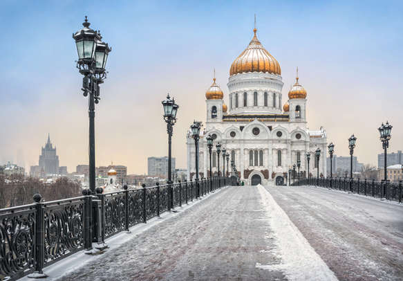 Warm mood of a cold winter on the Patriarchal bridge in Moscow near Christ the Savior Cathedral