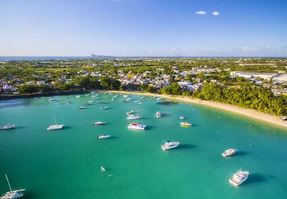 Mauritius beach with Grand Baie yacht harbor in North island