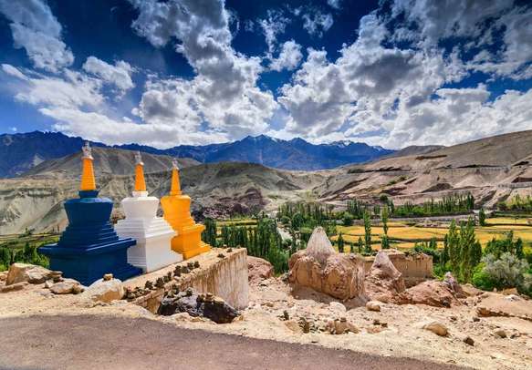 Three colourful buddhist religious stupas at Leh, Ladakh