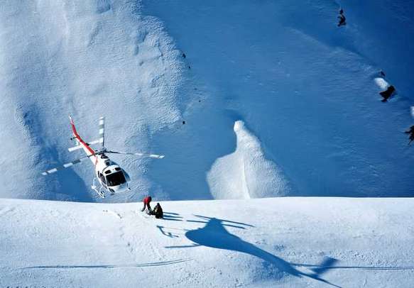 Experience the thrill of helicopter skiing during your holidays in New Zealand