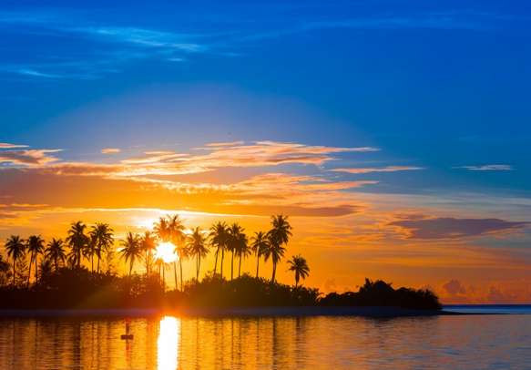 Revel in the tropical island sunset as you laze around at the beach.