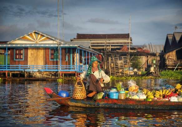 Local Cambodian seller in floating market.