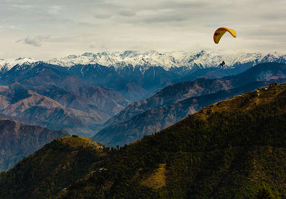 Opt for exciting acitvities like paragliding at George Hill