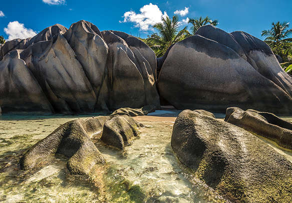 Relax with your partner by the beach in La Digue, Seychelles 