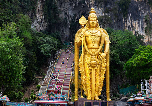 Visit Batu Caves that are said to be more than 400 million years old.