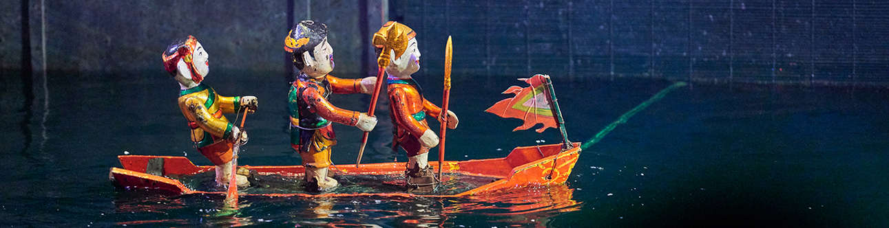 Watching Water Puppet Show In Hanoi