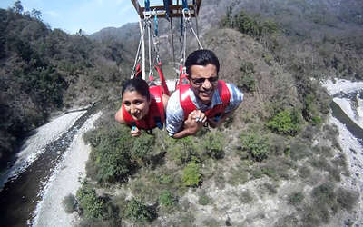 A couple celebrating Valentine’s Day by engaging in adventure activities like flying fox at Rishikesh