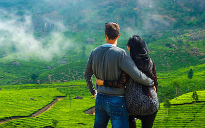 A couple enjoying the stunning green scapes of Munnar