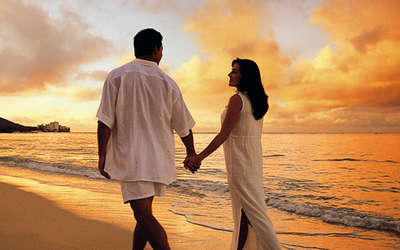 A couple strolling on the beach at sunset at Havelock, Andaman, one of the great places for Valentine’s Day