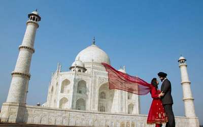A couple reveling in each other's company at Taj Mahal, one of the best places to go on Valentine's Day