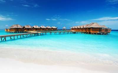 The overwater bungalows at the Fihalhohi Island Resort in Maldives