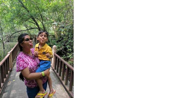 woman having fun with kid in langkawi