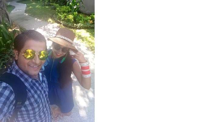 pankaj honeymoon trip to bali: pankaj and wife posing on bali beach