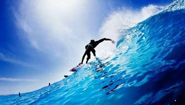 A professional sea surfing at Arugam Bay on a Sri Lankan beach