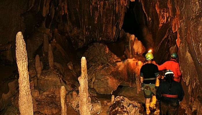 Tourists exploring cave in Meghalaya