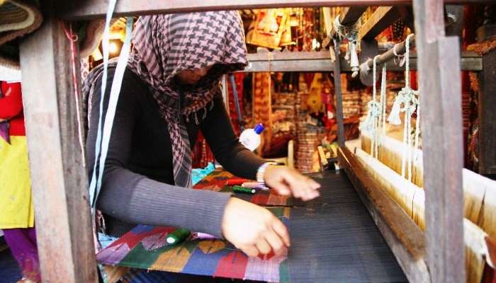 Hand made Pashmina on the loom by a textile worker