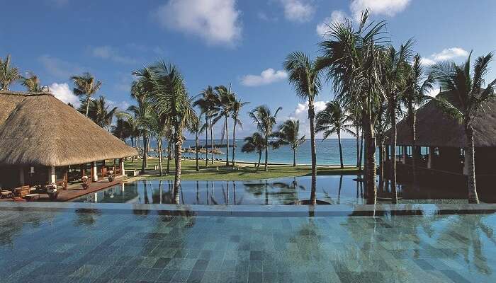 View of serene water villas at Belle Mare Plage - one of the best beach places in visit in Mauritius