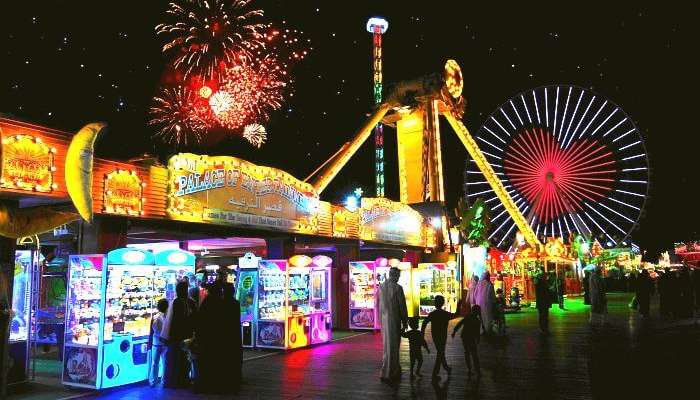 Tourists strolling through the global village and enjoying the Dubai Shopping festival