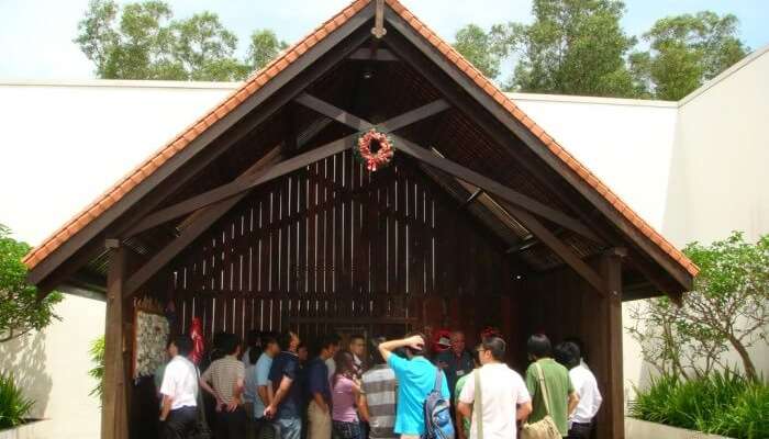 Tourists gather at the Changi Chapel inside the Changi museum