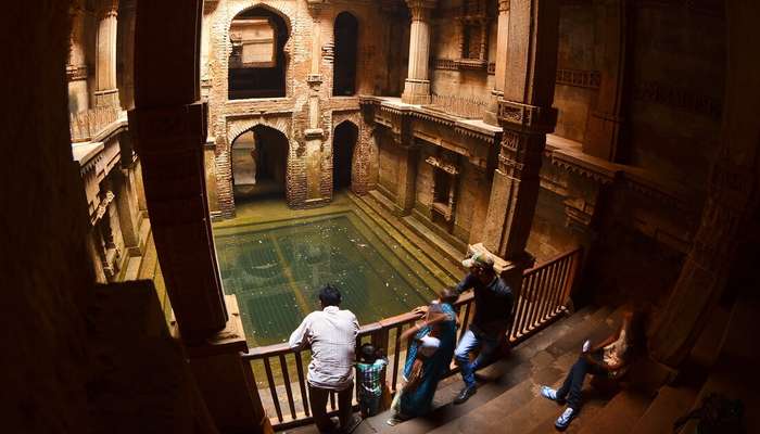 Visitors admire the architecture of Adalaj Ki Vav stepwell near Ahmedabad