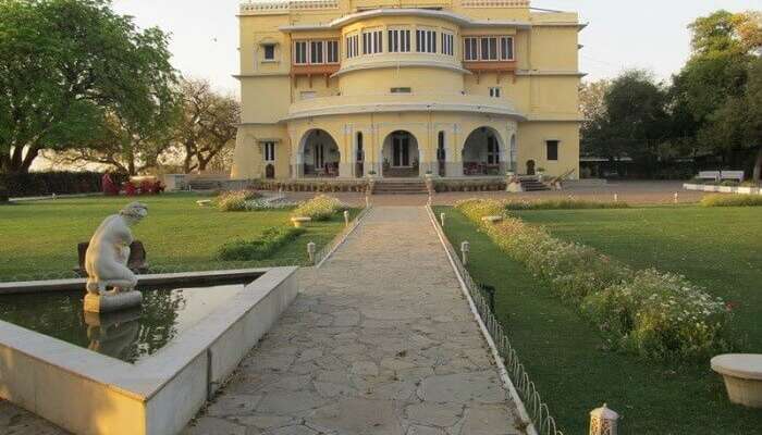 A beautiful view of the gardens and entrance of the haunted Brij Raj Bhavan Hotel in Kota