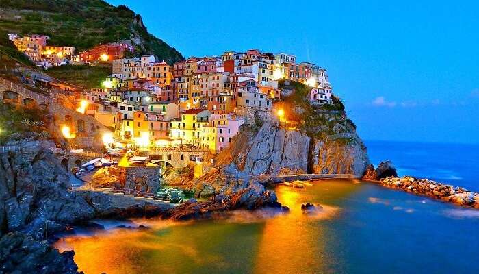 The beautifully lit-up Cinque Terre on an evening