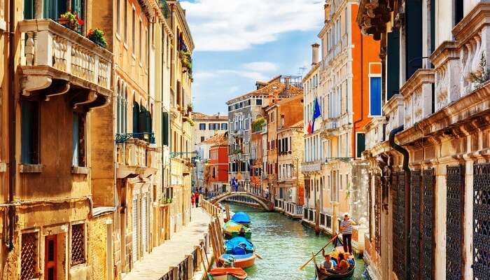 View of the Rio Marin Canal with boats and gondolas from the Ponte de la Bergami in Venice