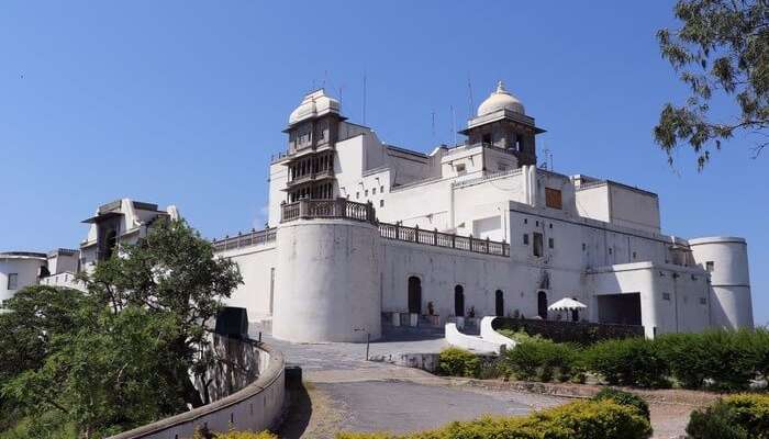 The grand building of Monsoon Palace is perched upon the hills