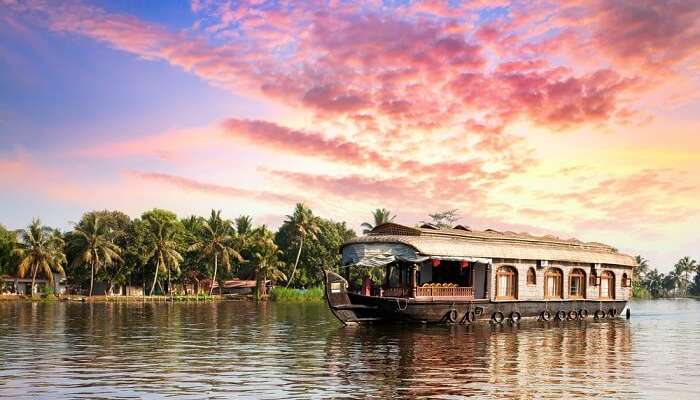 A houseboats floating in the backwaters of Alleppey at dusk