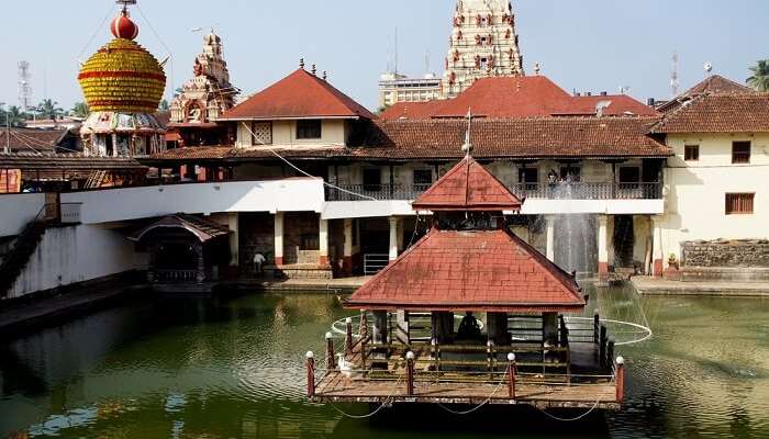 A temple in the middle of water reservoir at Udupi - One of the most religious tourist places to visit in Karnataka