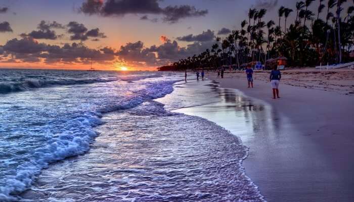 Waves along with the sun cast an orange hue on Radhanagar beach in Havelock island