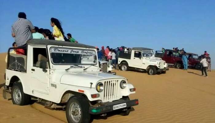 Visitors enjoying jeep safari in Jaisalmer