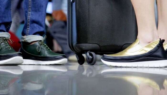 Travelers wearing the modular tech travel shoes