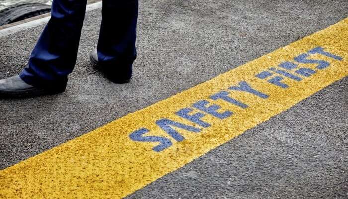 Safety tips written on a road in Thailand