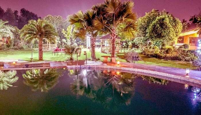 An evening shot of the pool at the Botanix Resort near Gurgaon