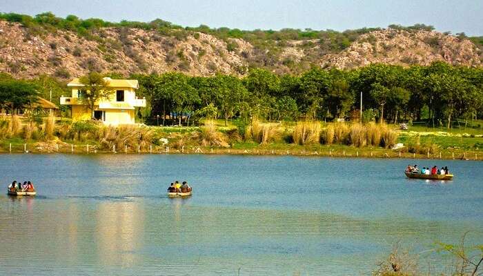 Tourists boating in the Damdama Lake that is one of the weekend getaways near Gurgaon