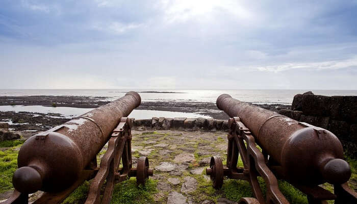 two canons facing the beach in Alibaug