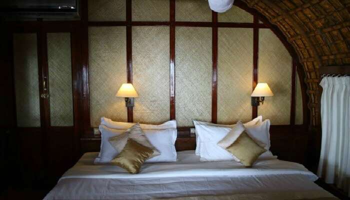 A well laid-out bedroom of Spice Coast Cruises in Alleppey