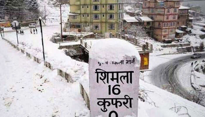 Milestone in Shimla covered in snow by the road