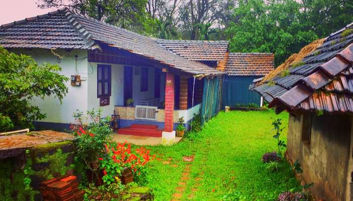 a beautiful old homestay with a small lawn