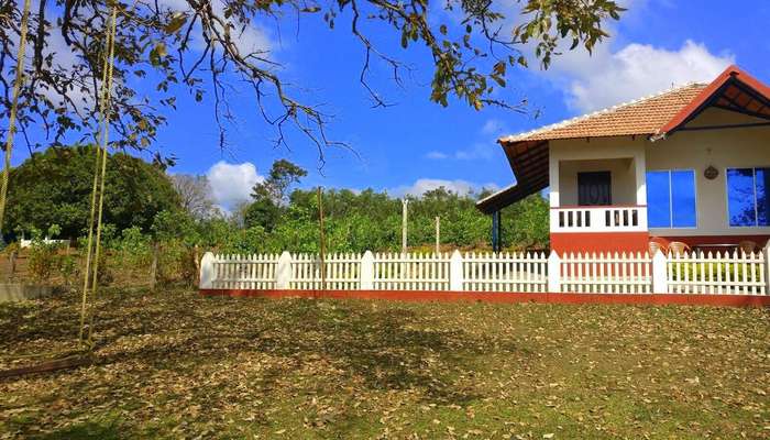 a beautiful home with fences and a big garden