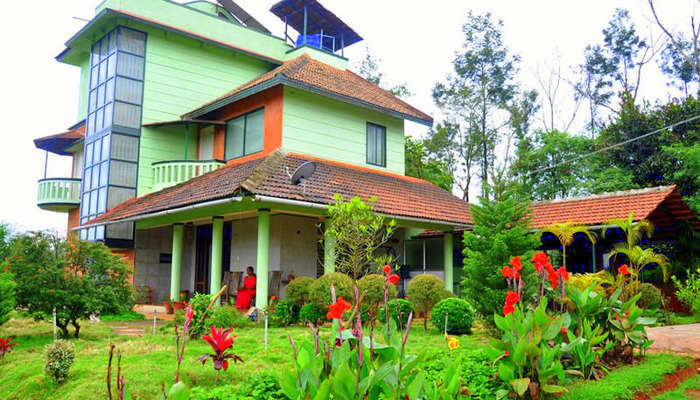 a Karnataka style home painted green