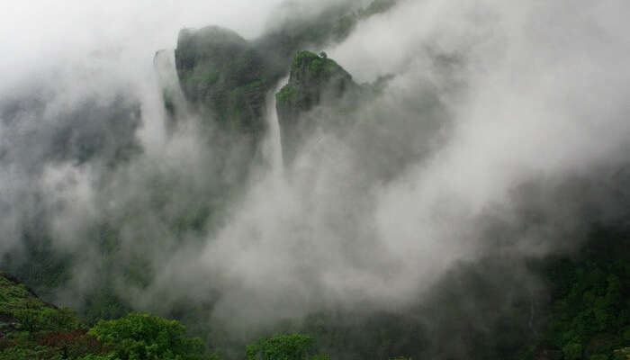 mountain peaks covered by mists