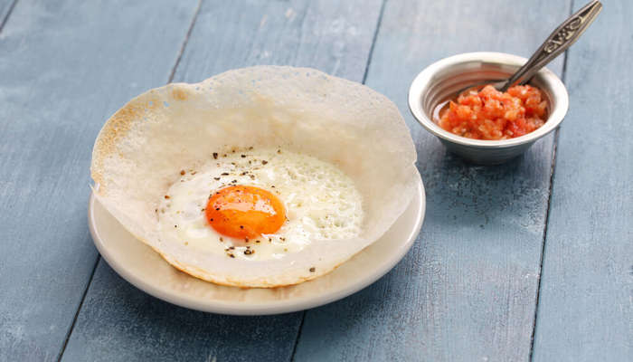 bowl style appam with an egg in the middle
