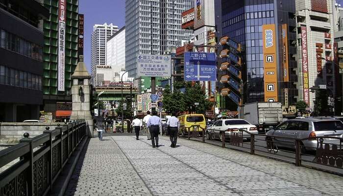 people walking across the road in Akihabara