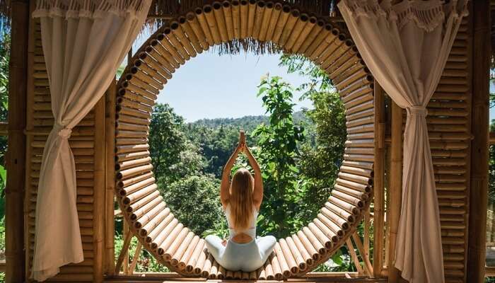 Young woman practicing yoga at the Yoga Barn