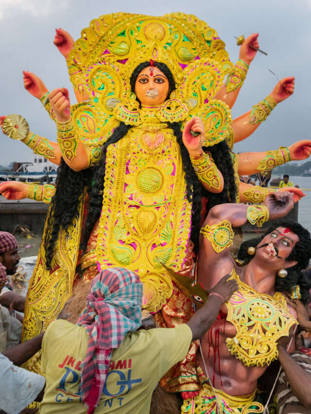 Goddess Durga idol is being immersed in holy river Ganges.