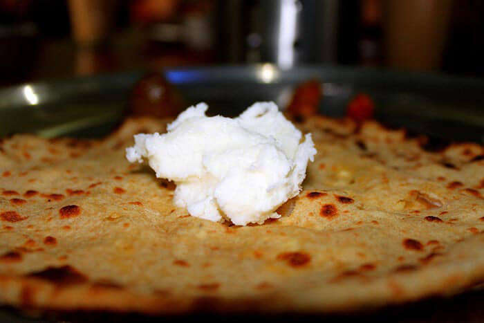 savour the taste of delicious paranthas loaded with white butter at murthal