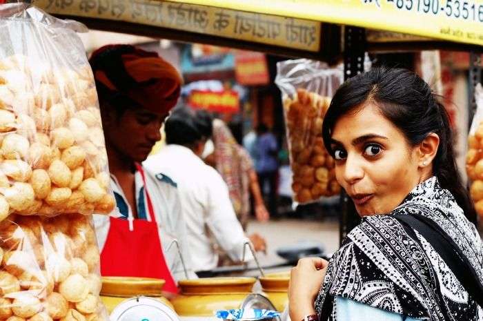 A girl excited about eating the best Gol gappas in Delhi