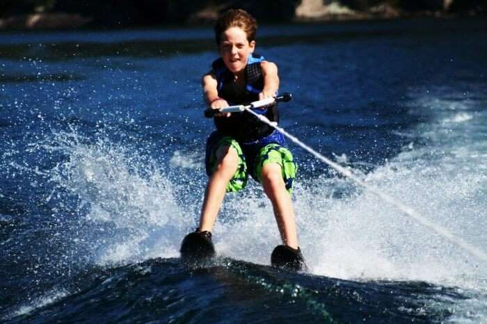 A kid water skiing in Thailand